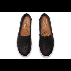 Tom’s Black Coated Canvas Woman’s Avalon slip ons